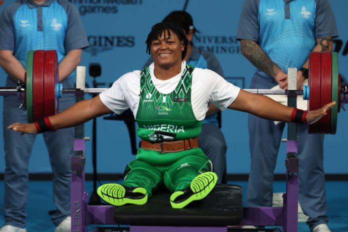 A female Para powerlifter reacting after a lift