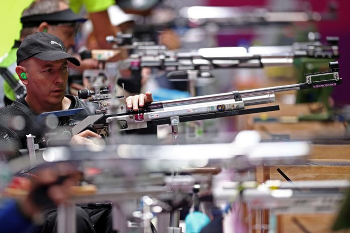Male athletes compete in shooting Para sport at the Tokyo 2020 Paralympics.