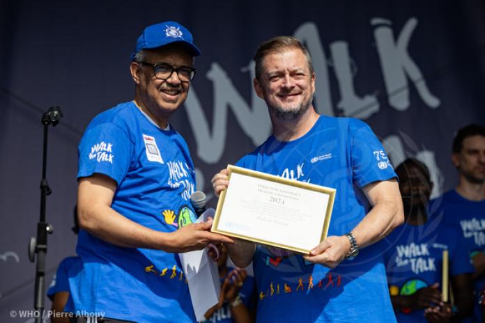 IPC President Andrew Parsons and Dr Tedros Adhanom Ghebreyesus, WHO Director-General, pose for a photograph together.