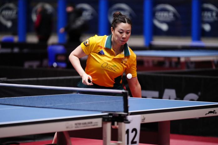 A female Para table tennis player in action.