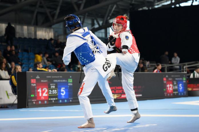 Two female Para taekwondo athletes in action