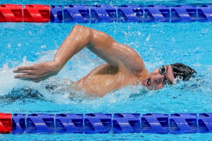 A male Para swimmer in competition