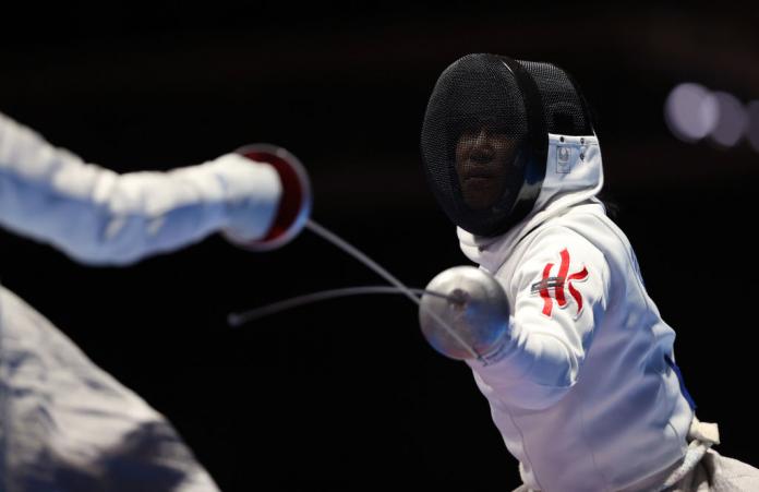 A female wheelchair fencer in action at the Tokyo 2020 Paralympics.