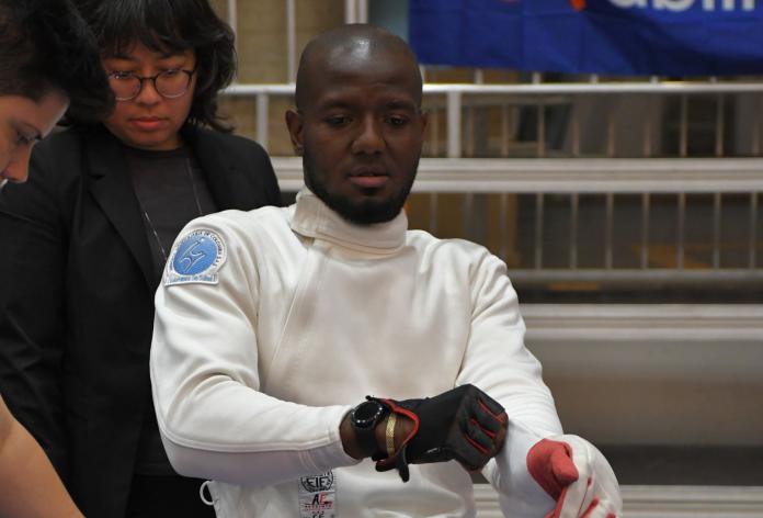 Amelio Castro Gruesso, a member of the Refugee Paralympic Team at Paris 2024, is wearing his wheelchair fencing gear