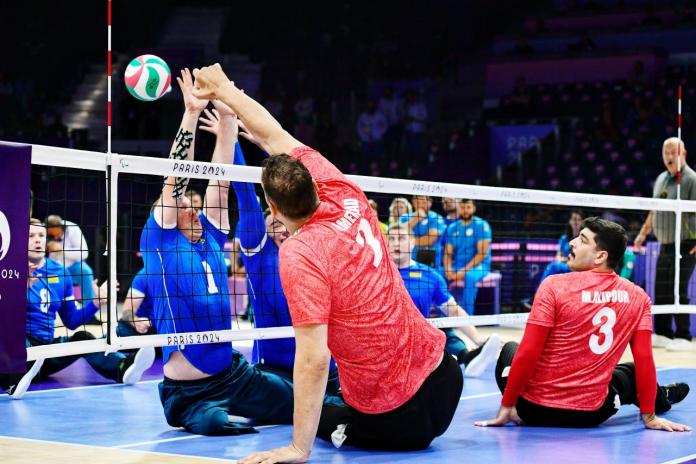 A men's sitting volleyball match