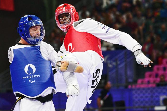 Para taekwondo fighter Idrissa Keita kicking an opponent