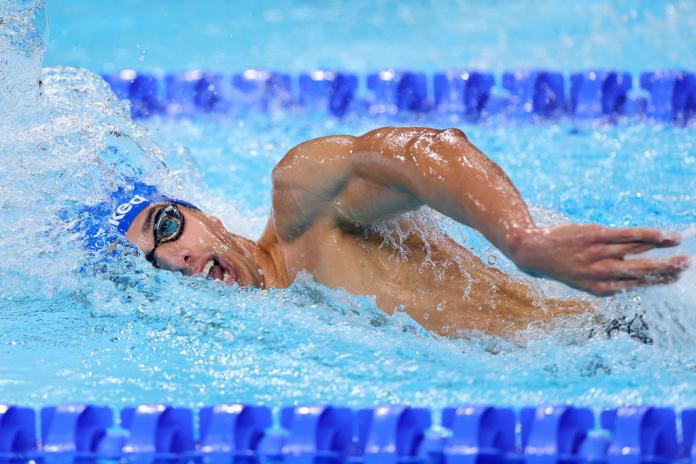 Para swimmer Simone Barlaam swimming freestyle in the pool