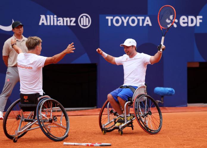 Sam Schroder and Nils Vink throw their arms up in celebration