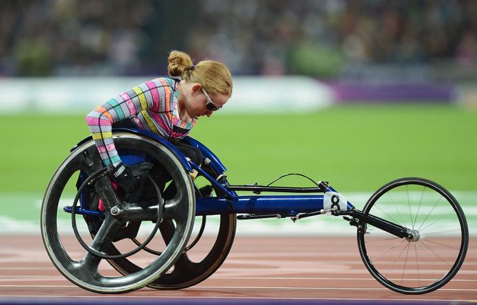 A female wheelchair racing athlete takes to the track at London 2012
