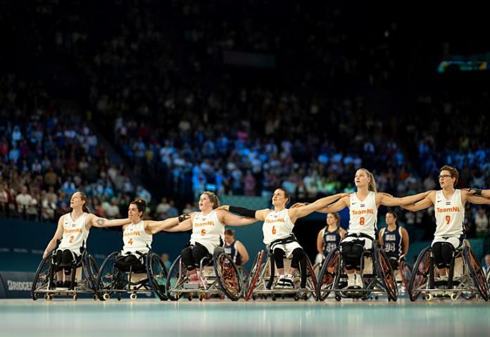 The Netherlands team with arms over shoulders singing the national team 