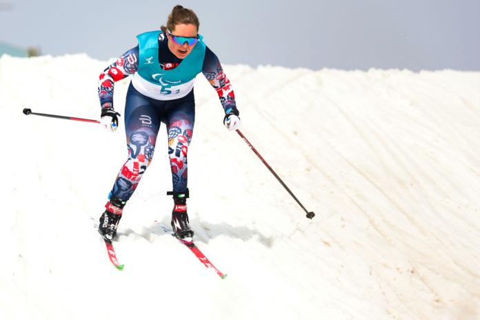 A female Para cross-country skier in action