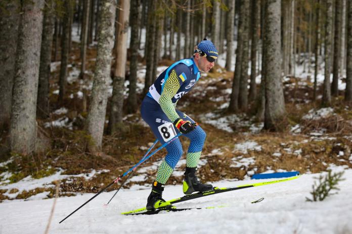 A male Para biathlon athlete in action