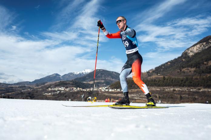 A male skier competes in Para cross-country skiing