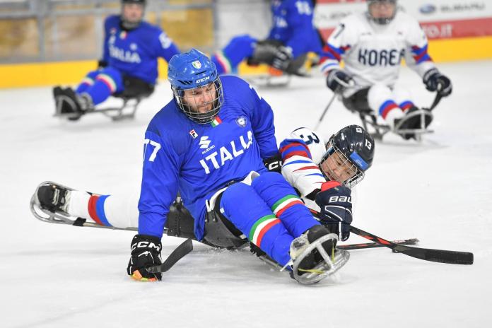 A male Para ice hockey athlete in action