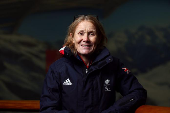 Penny Briscoe is smiling at the camera. She is wearing Great Britain's blue uniform