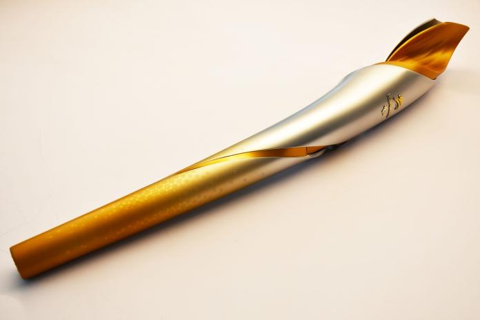 The torch of the Beijing 2022 Paralympic Winter Games is in silver and gold