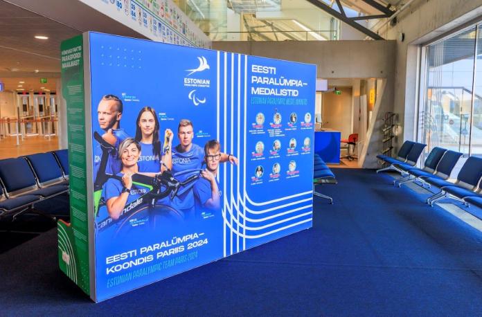 A photo of an exhibition at an airport. Photos of Paralympic athletes are displayed