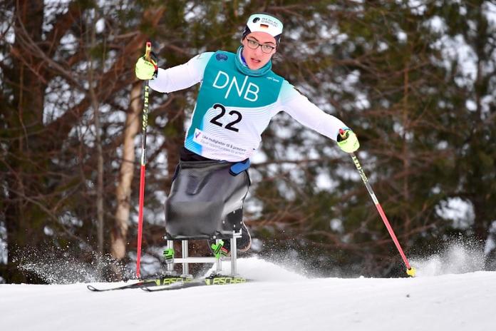  A female Para cross-country sit-skier competes