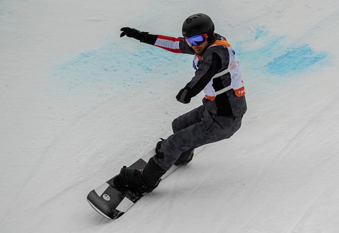 A male Para snowboarder in action at PyeongChang 2018