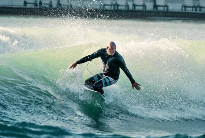 A male athlete surfing