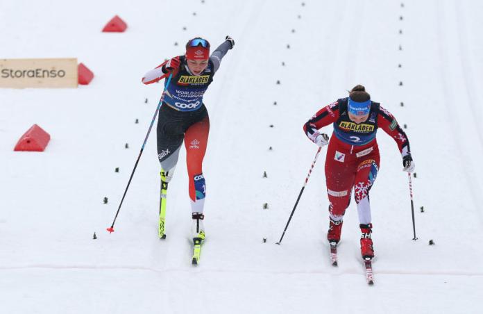 Two Para cross-country skiers are racing side-by-side