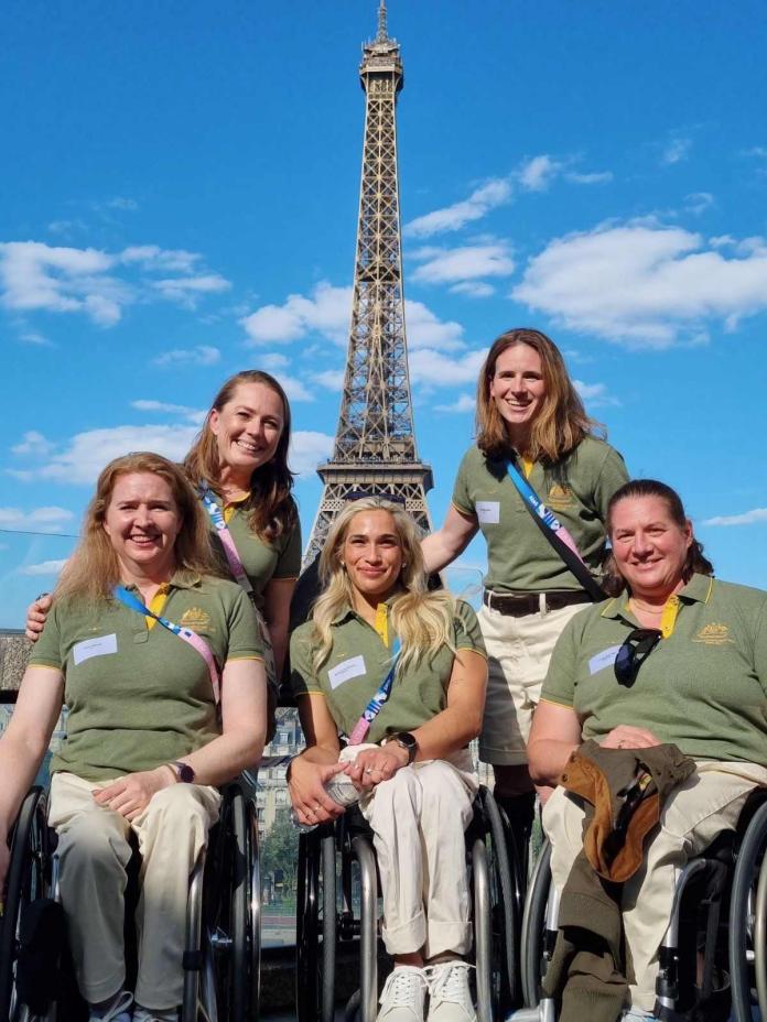 Birdie Kean posing with the Australian team at the Paris 2024 Paralympics.