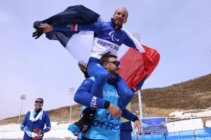 A male athlete is celebrating