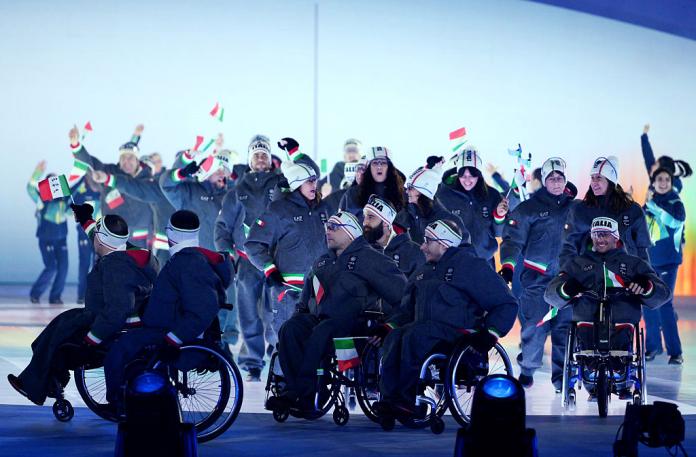 A group of Italian athletes enter the arena during the Opening Ceremony