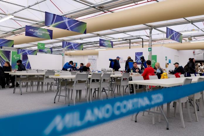 The eating hall in the Paralympic village in Cortina, where people are sitting together and having lunch