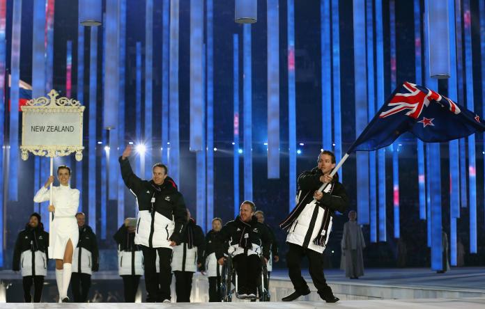 New Zealand enters the arena lead by flag bearer Adam Hall during the Opening Ceremony of the Sochi 2014 Paralympic Winter Games