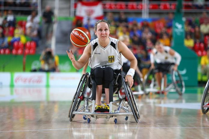 a wheelchair basketballer goes for a shot