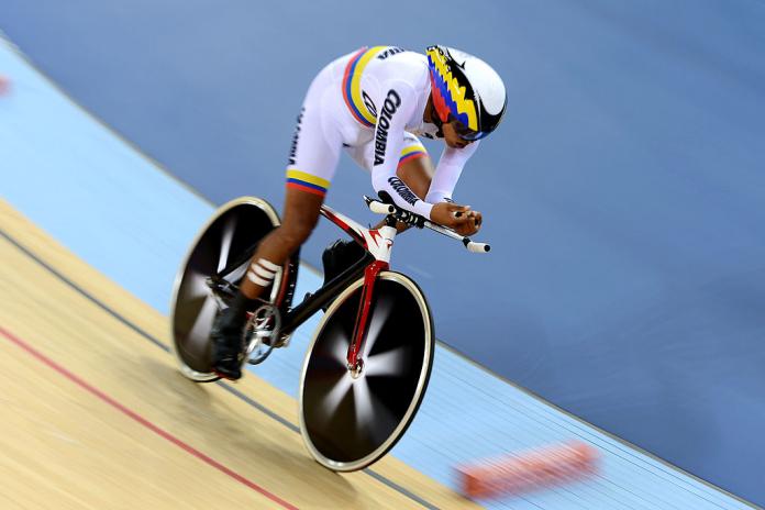 a para cyclist rides around the track