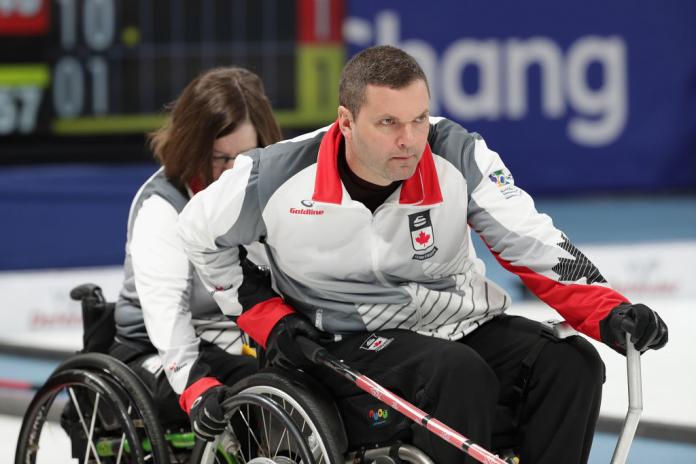 a male wheelchair curling player