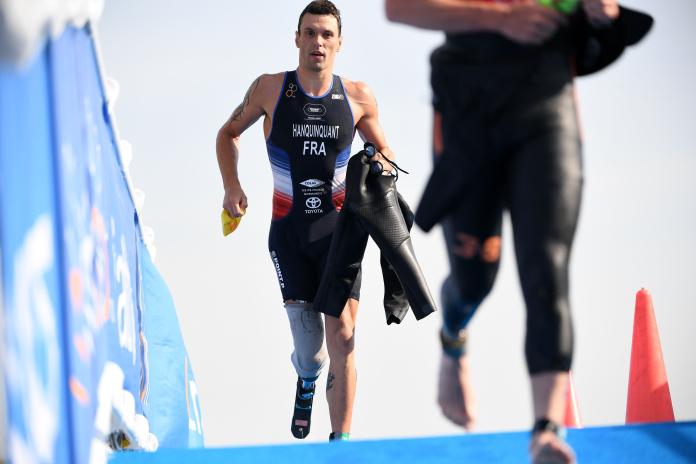 male Para triathle Alexis Hanquinquant sprints towards the finish line