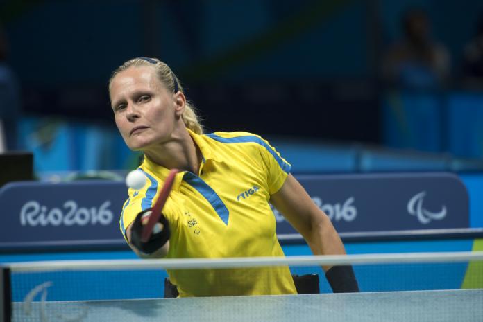 female Para table tennis player Anna-Carin Ahlquist hits a forehand