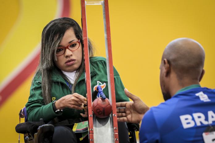 female boccia player Evelyn de Oliveira prepares to play a ball