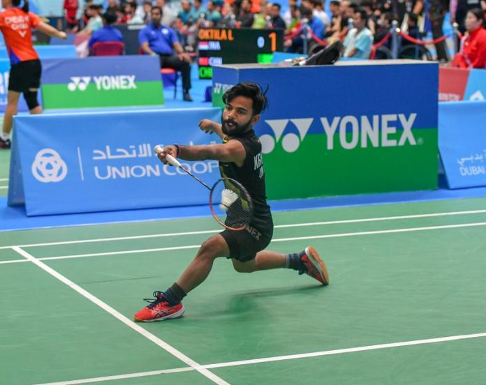 male Para badminton player Krishna Nagar plays a forehand