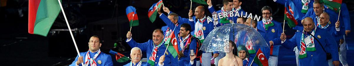 a group of Para athletes walking at an opening ceremony