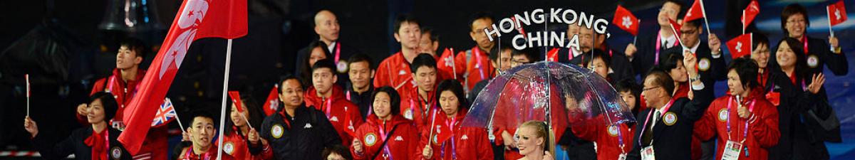 a group of Para athletes walking at an opening ceremony
