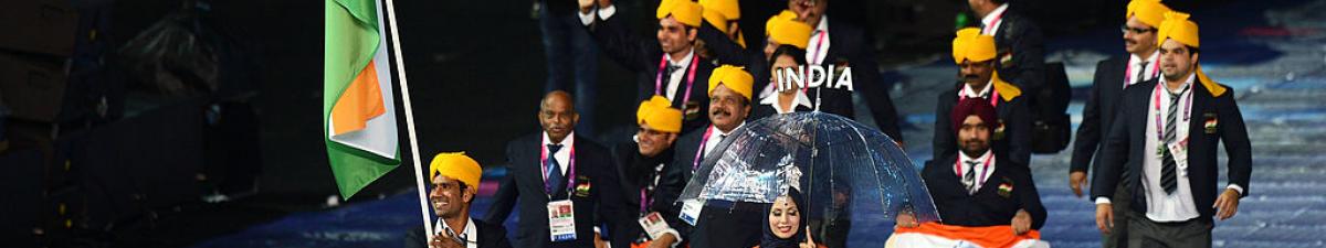 a group of Para athletes walking at an opening ceremony