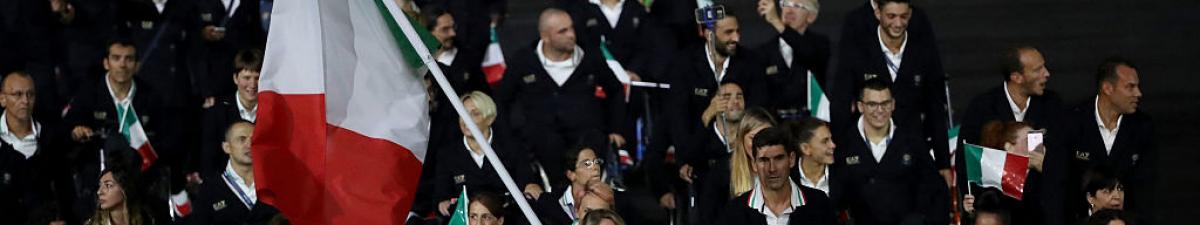 a group of Para athletes walking at an opening ceremony