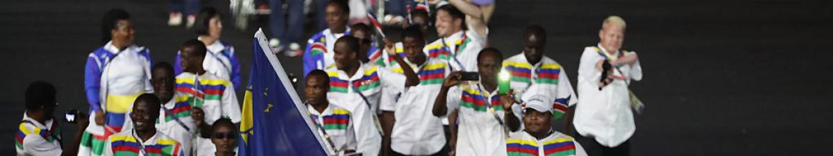 a group of Para athletes walking at an opening ceremony