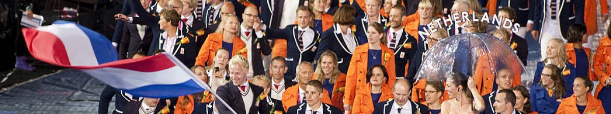 a group of Para athletes walking at an opening ceremony