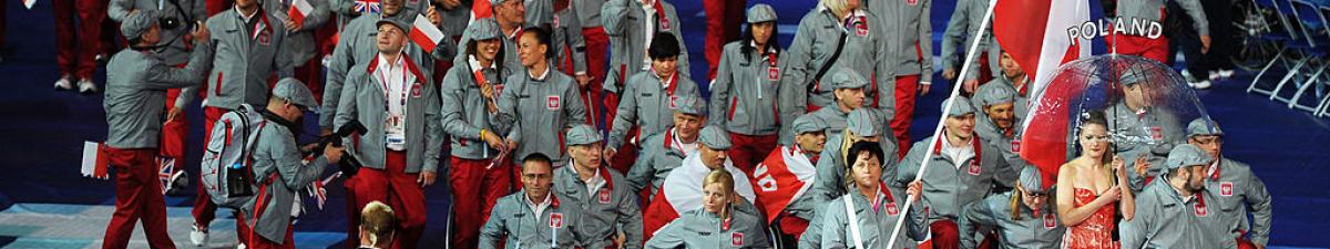 a group of Para athletes walking at an opening ceremony