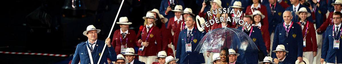 a group of Para athletes walking at an opening ceremony