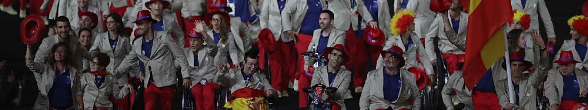 a group of Para athletes walking at an opening ceremony