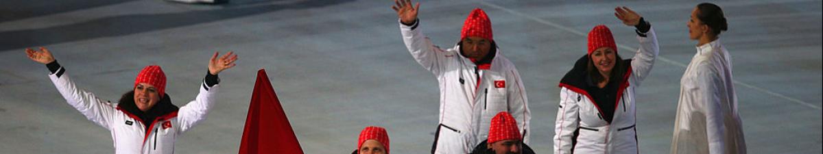 a group of Para athletes walking at an opening ceremony