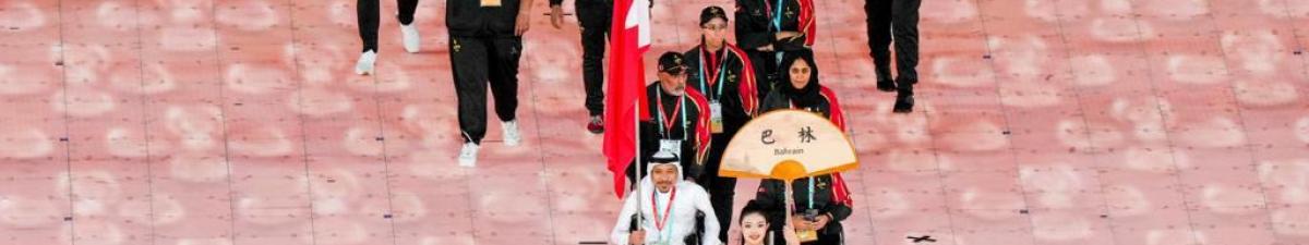Bahrain NPC holding the country&#039;s flag