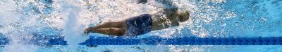 Two male Para swimmers underwater in a competition