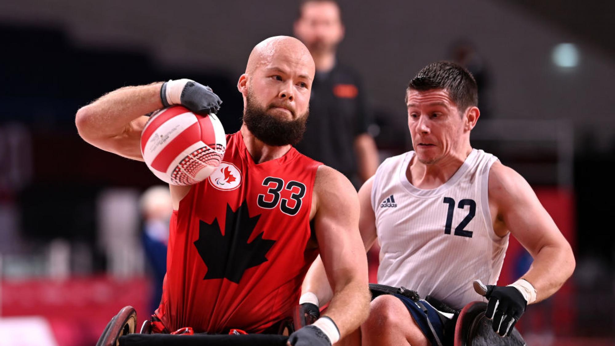 A male wheelchair rugby player in action during the Tokyo 2020 Paralympics.